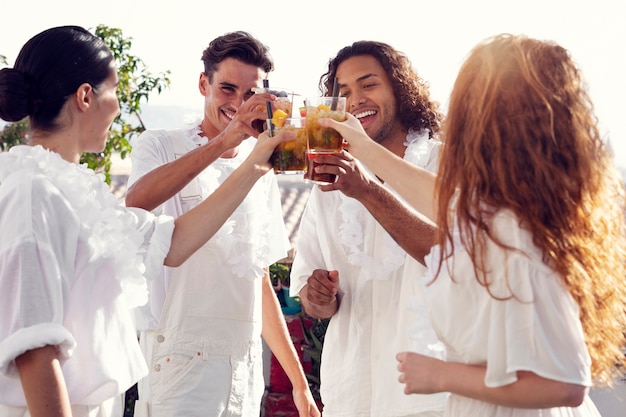 Young adult having fun at white party