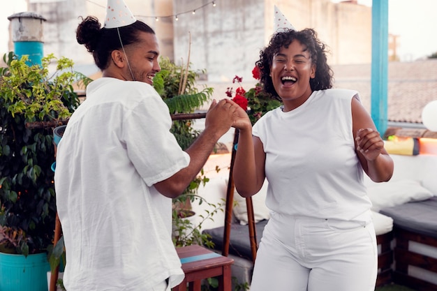 Young adult having fun at white party