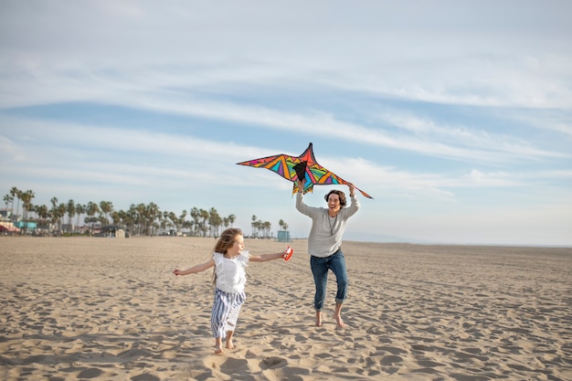 Young adult having fun with kite