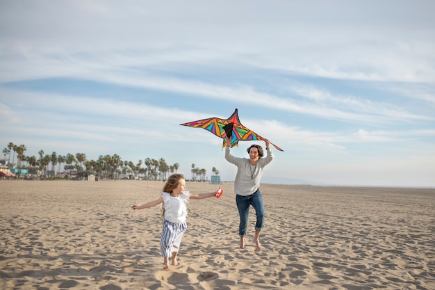 Free photo young adult having fun with kite