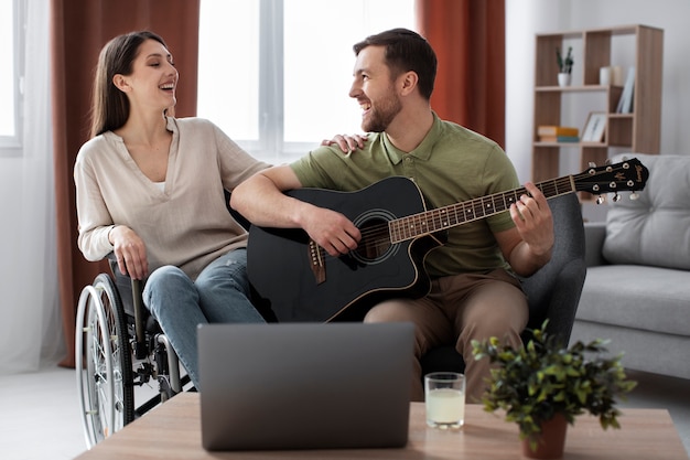 Young adult helping disabled friend