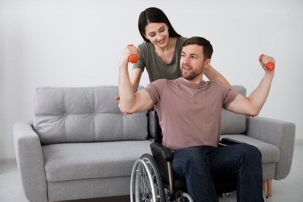 Young adult helping disabled friend