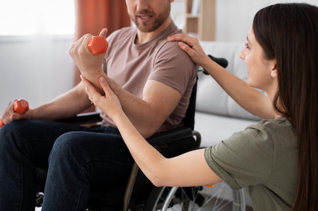 Young adult helping disabled friend