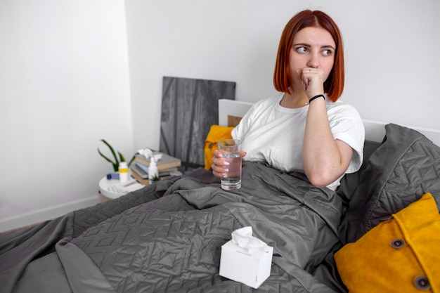 Young adult at home suffering from illness