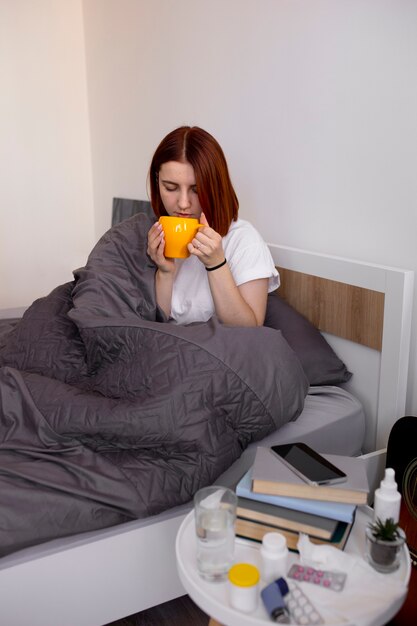 Young adult at home suffering from illness