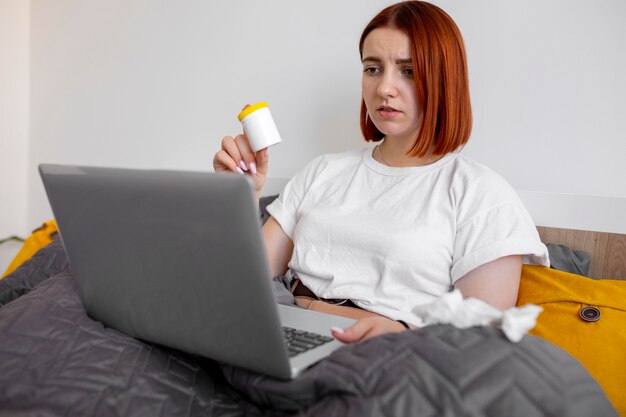 Young adult at home suffering from illness