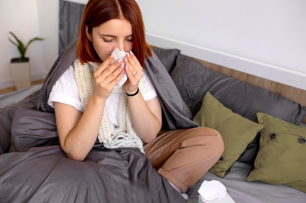 Free photo young adult at home suffering from illness