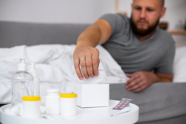 Young adult at home suffering from illness