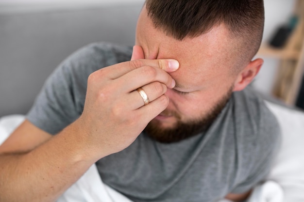 Young adult at home suffering from illness