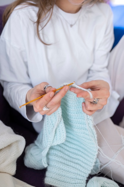 Free photo young adult knitting together