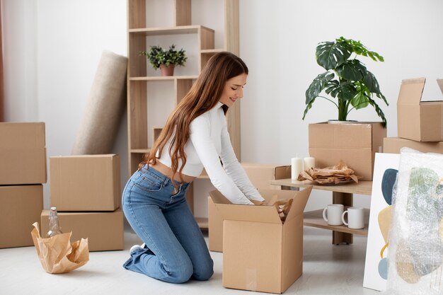 young adult moving in new house
