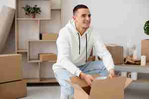 Free photo young adult moving in new house