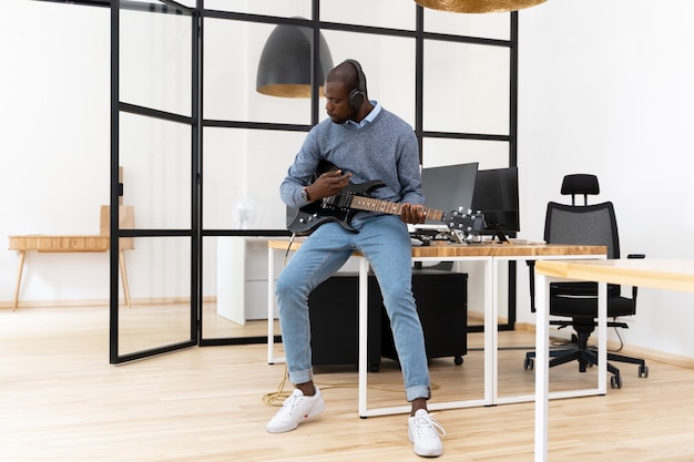 Young adult playing the guitar