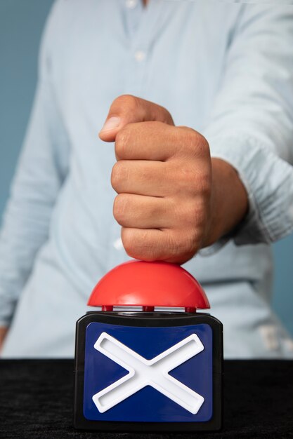 Young adult pressing buzzer button