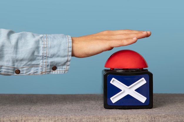 Young adult pressing buzzer button