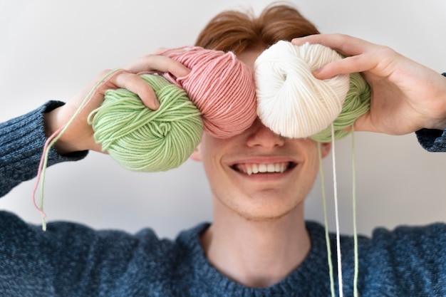 Young adult ready for knitting at home