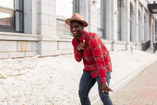 Young adult in red shirt dancing