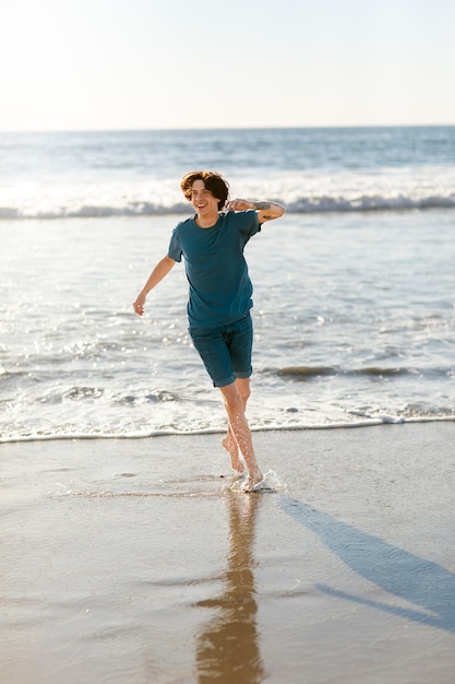 Young adult running near seaside