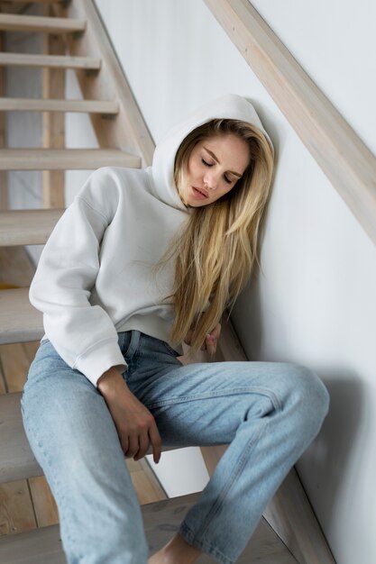 Young adult sleeping on stairs