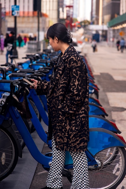 Young adult using bike to travel in the city