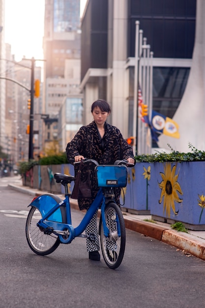 Young adult using bike to travel in the city