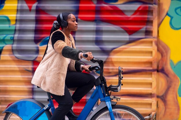 Young adult using bike to travel in the city