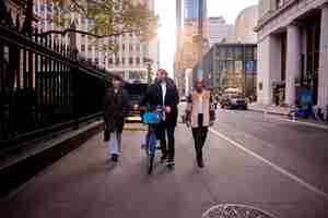 Free photo young adult using bike to travel in the city