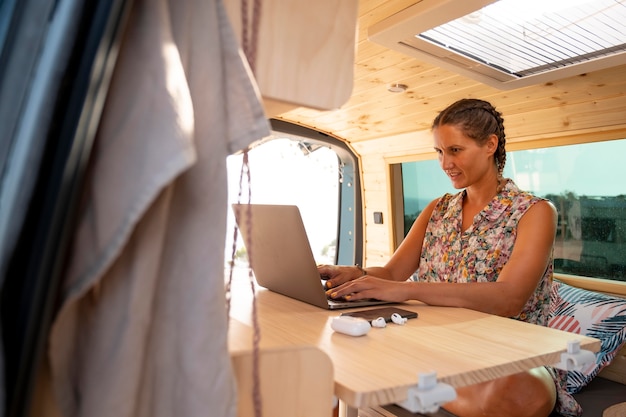 Young adult using digital device while travelling