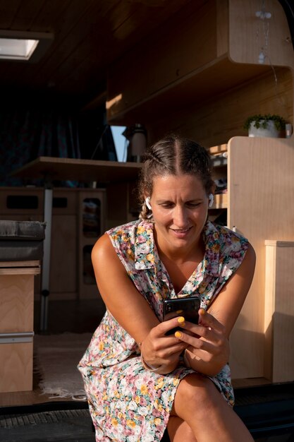 Young adult using digital device while travelling