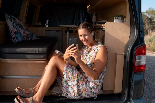 Young adult using digital device while travelling