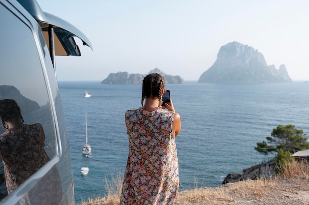 Young adult using digital device while travelling