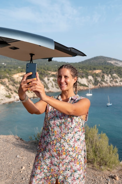 Young adult using digital device while travelling