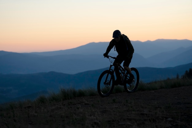 Young adult using electric bike in the country side