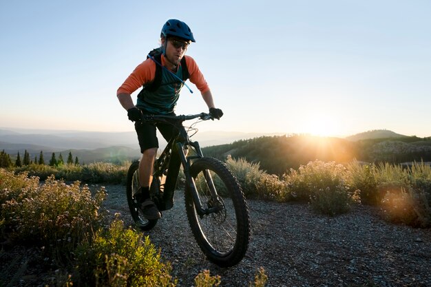 Young adult using electric bike in the country side