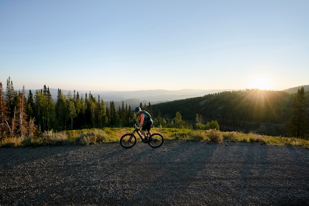 Young adult using electric bike in the country side