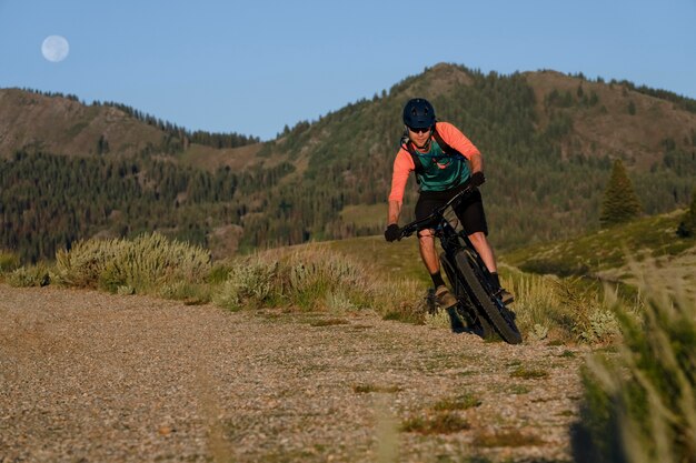 Young adult using electric bike in the country side