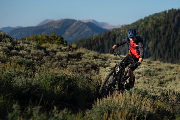 Young adult using electric bike in the country side