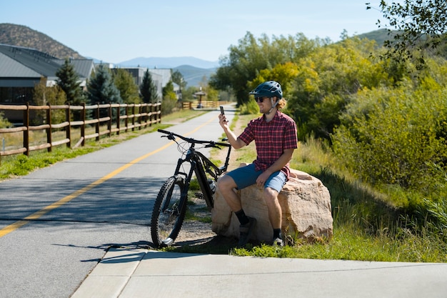 Young adult using electric bike in the country side