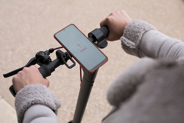 Young adult using electric scooter for transportation