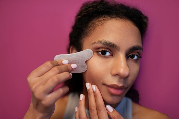 Young adult using face care product