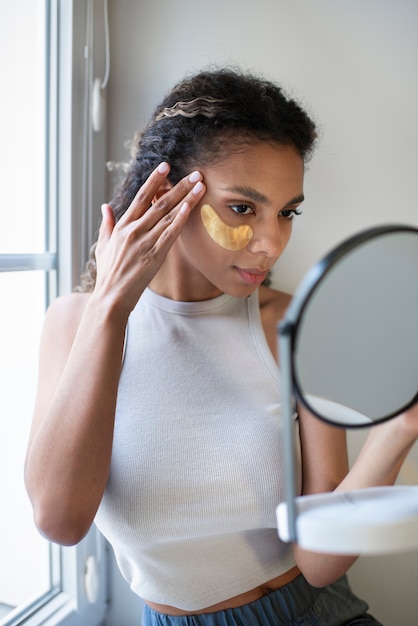 Young adult using face care product