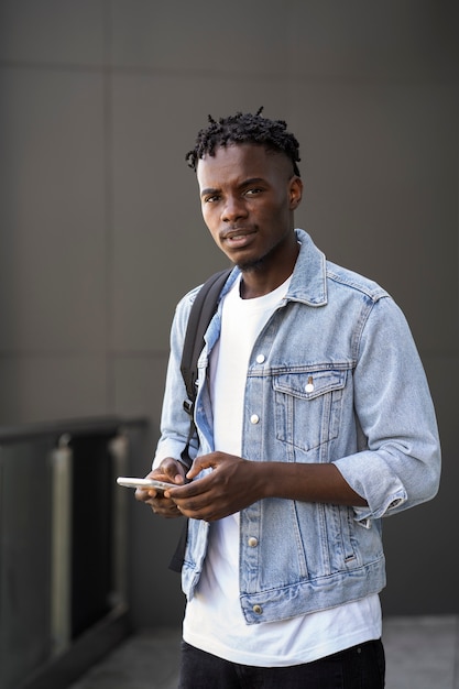 Young adult using his digital device
