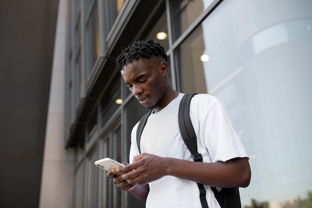 Young adult using his digital device