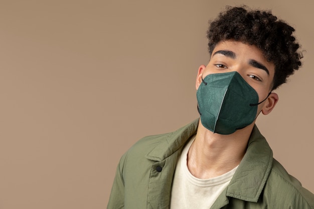 Free photo young adult wearing face mask