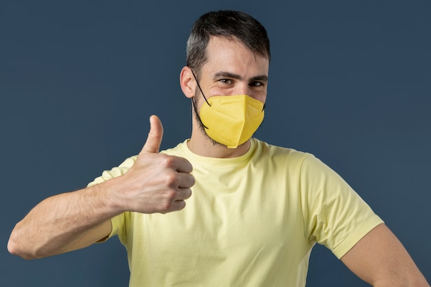 Free photo young adult wearing face mask