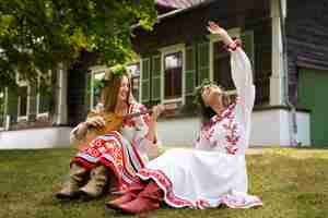 Free photo young adults having fun while folk dancing