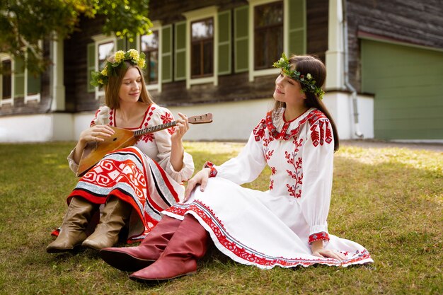 Free photo young adults having fun while folk dancing