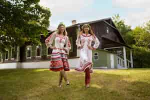 Free photo young adults having fun while folk dancing