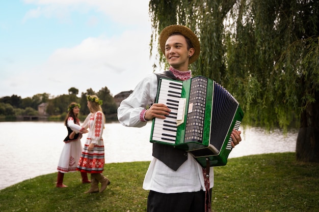 Free photo young adults having fun while folk dancing