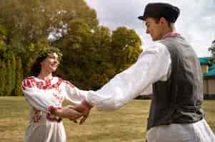 Free photo young adults having fun while folk dancing